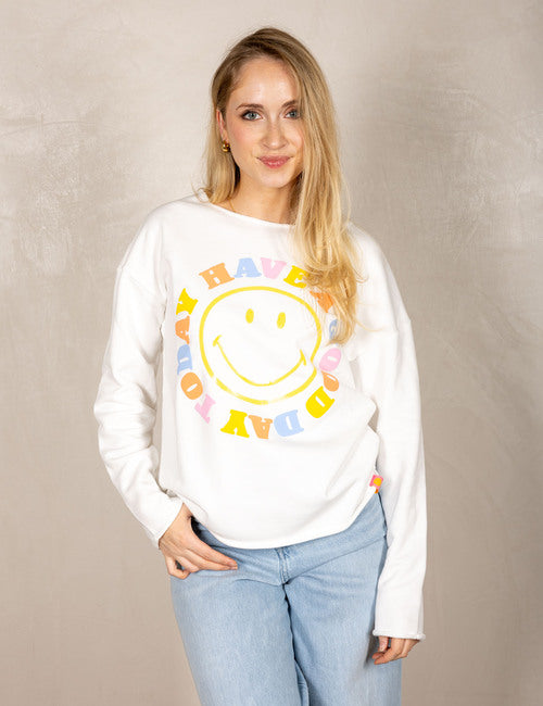 White sweater with smiley face and “Today I Have a Good Day” print