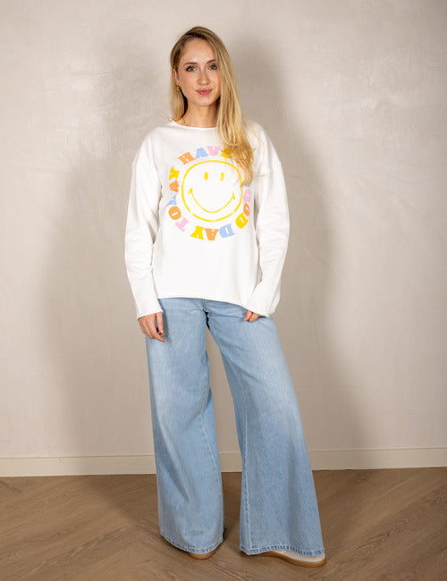 White sweater with smiley face and “Today I Have a Good Day” print